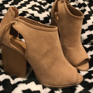 Peep toe ankle booties.